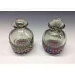 A near pair of 19th century millefiori ink bottles, the bases set with coloured concentric canes,