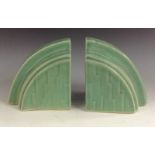 A pair of Langley Art Deco bookends, of cloud form, glazed in mint green tones, c.