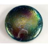 A John Ditchfield type iridescent glass paperweight, with applied white metal dolphin,