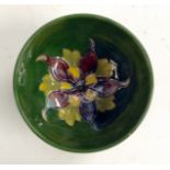 A Moorcroft Columbine circular dish, tubelined flower and foliage to the centre of the bowl,