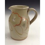 A Gray's Pottery Susie Copper stoneware jug, lightly decorated in orange,
