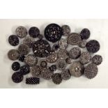 An assortment of Victorian, Edwardian and later black glass buttons, with silver lustre effect,