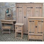A Waring and Gillows limed oak bedroom suite, comprising triple wardrobe, dressing table,