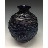 A Kralik Chine iridescent blue ovoid glass vase, dimpled sides, applied glass threading, 16cm high,