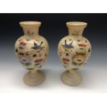 A pair of Victorian opaque glass pedestal vases, painted with birds and flowering foliage,