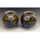A pair of Royal Doulton stoneware ovoid vases, by Florrie Jones,