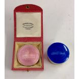 A silver and pink guilloche enamel compact, circular body, retailed by Wilson and Gill,