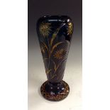 A Stevens and Williams blue over amber flash cut spreading ovoid glass vase,