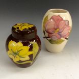 A Moorcroft Bermuda ginger jar, tubelined yellow flowers on a brown ground, 11cm high,