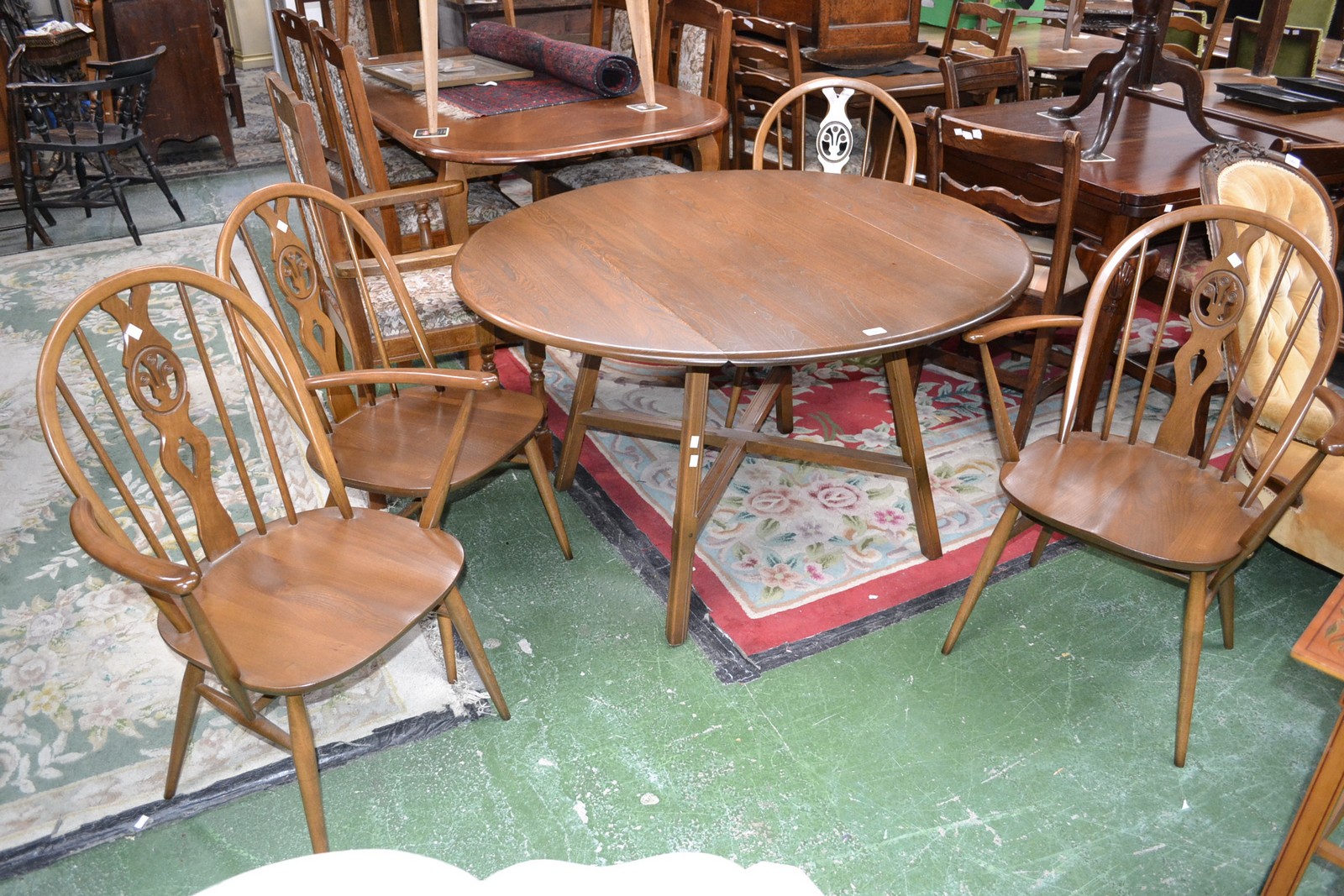 An Ercol dropleaf table and four chairs,