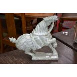 A 20th century carved soap stone model of a braying horse