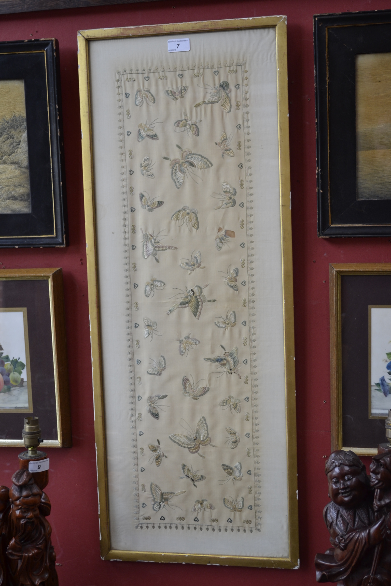 A Chinese silk panel, embroidered with butterflies in flight,