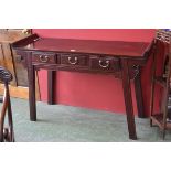 A hardwood Chinese altar table, crossbanded top, raised shaped apron shaped ends,