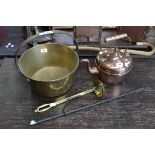 A large brass jam pan and ladle spoon;