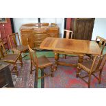 A 1950's oak dining room suite,comprising drawleaf dining table, six, matching dining chairs,