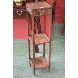 A Chinese padouk wood three tier plant stand, square recessed top,
