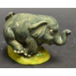 A novelty miniature elephant model, Morloy, hand painted, 6.5cm high, c.