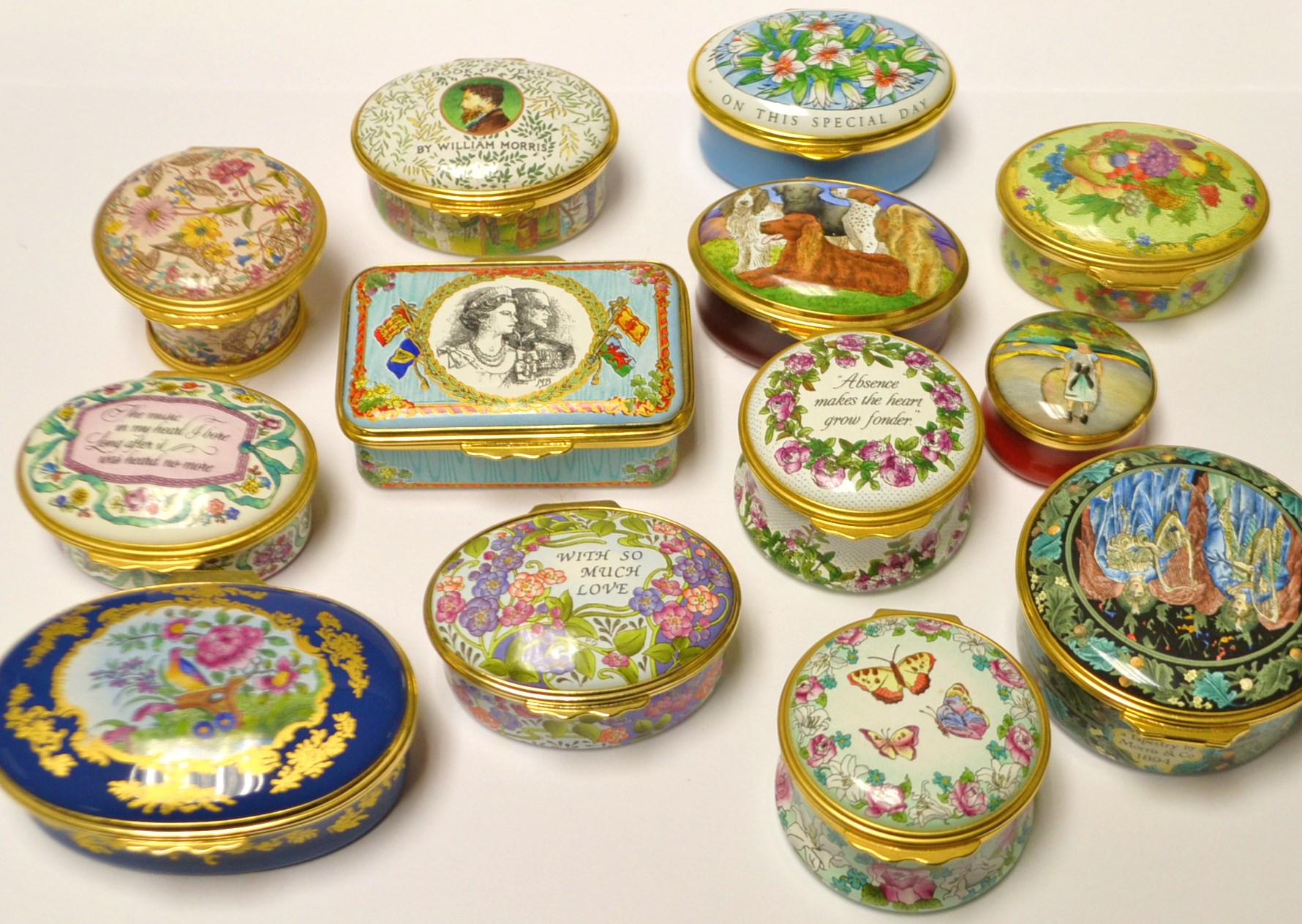 A Halcyon pill box decorated with butterflies;  a Staffordshire pill box decorated with flowers,