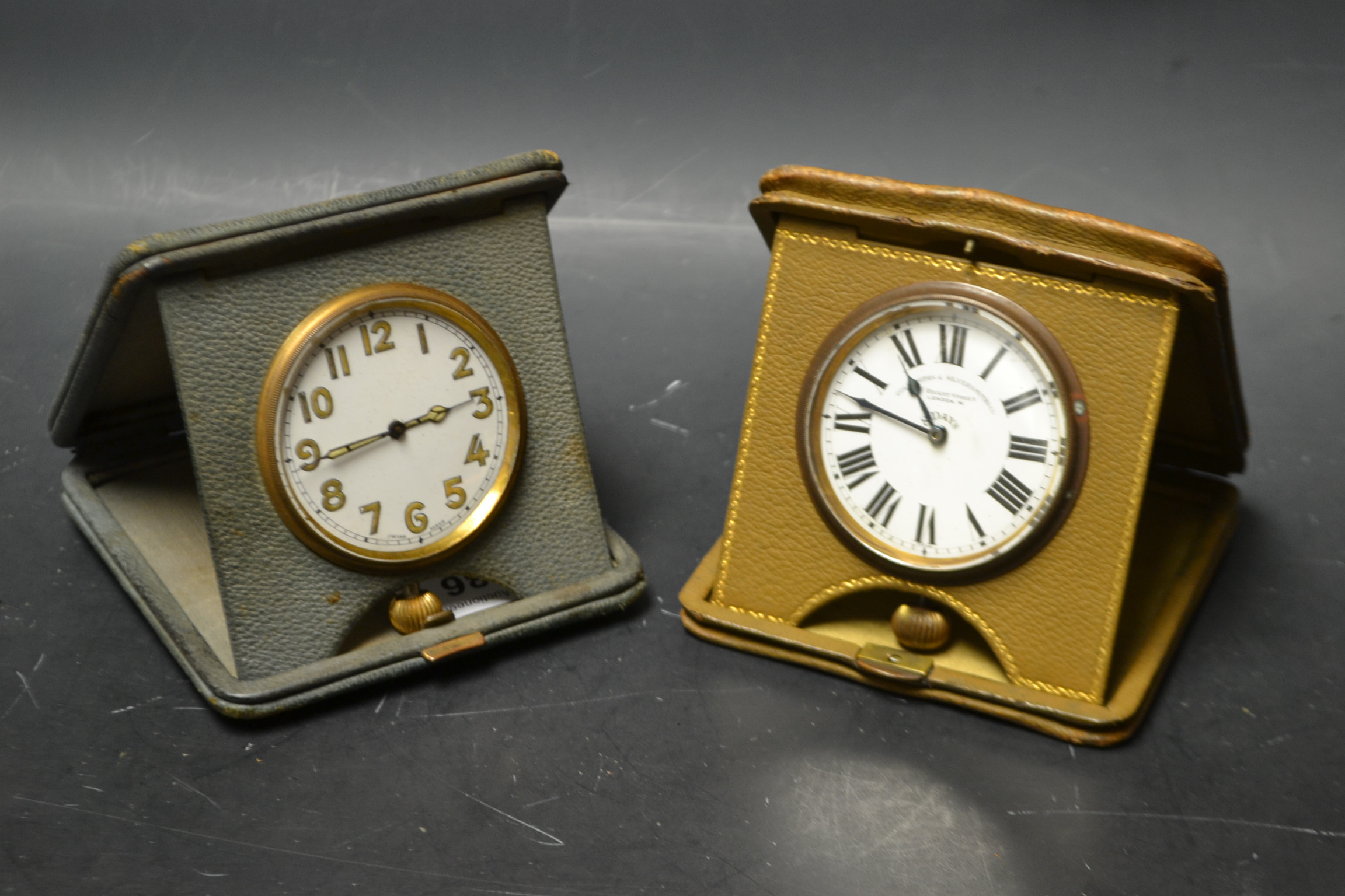 A Goldsmiths and Silversmiths 8 day leather cased travel clock;