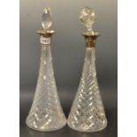A pair of silver mounted cut glass decanters,