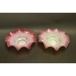 A pair of 19th century Continental glass blush dishes, wavy rim, stipple decoration in relief,