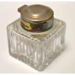 A silver topped inkwell