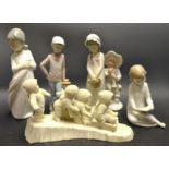 A Nao Spanish porcelain figure young boy and his dog;