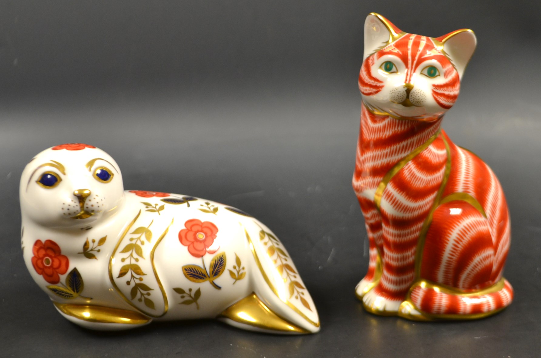 A Royal Crown Derby paperweight of a ginger cat,