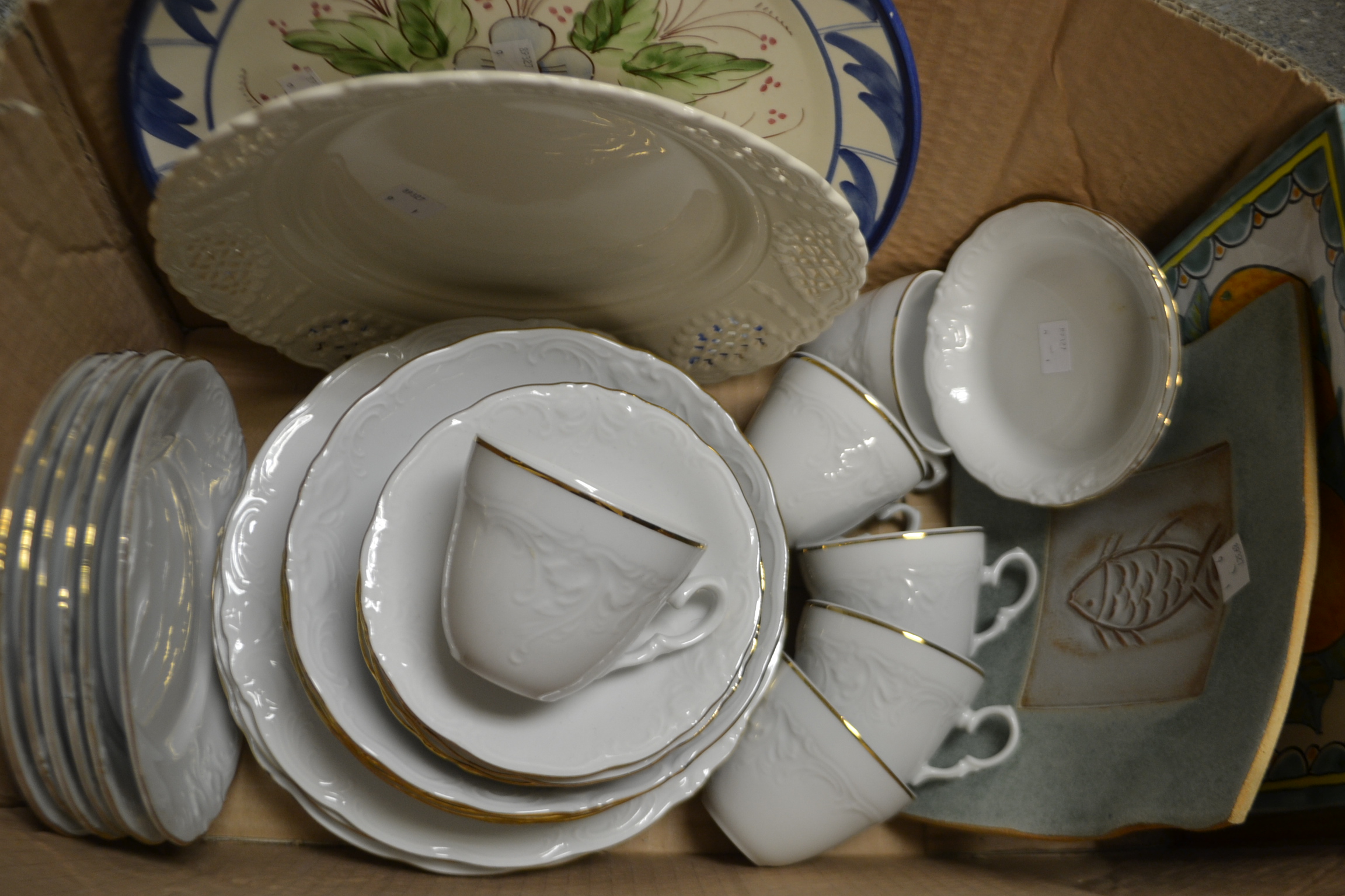 A contemporary porcelain dinner service; a modern cream ware serving plate; other modern ceramics;