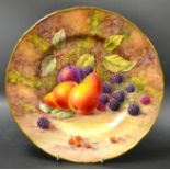 A Royal Worcester shaped circular plate, painted with pears,