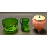 A Mary Gregory vaseline green glass jug and bowl;