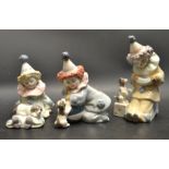 A set of three Lladro clown figures