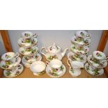 A Royal Albert Highland Thistle tea service comprising, teapot, ten cups, thirteen saucers,