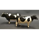 A pair of Beswick Frisian cattle; bull "Champion Coddington Hilt Bar",