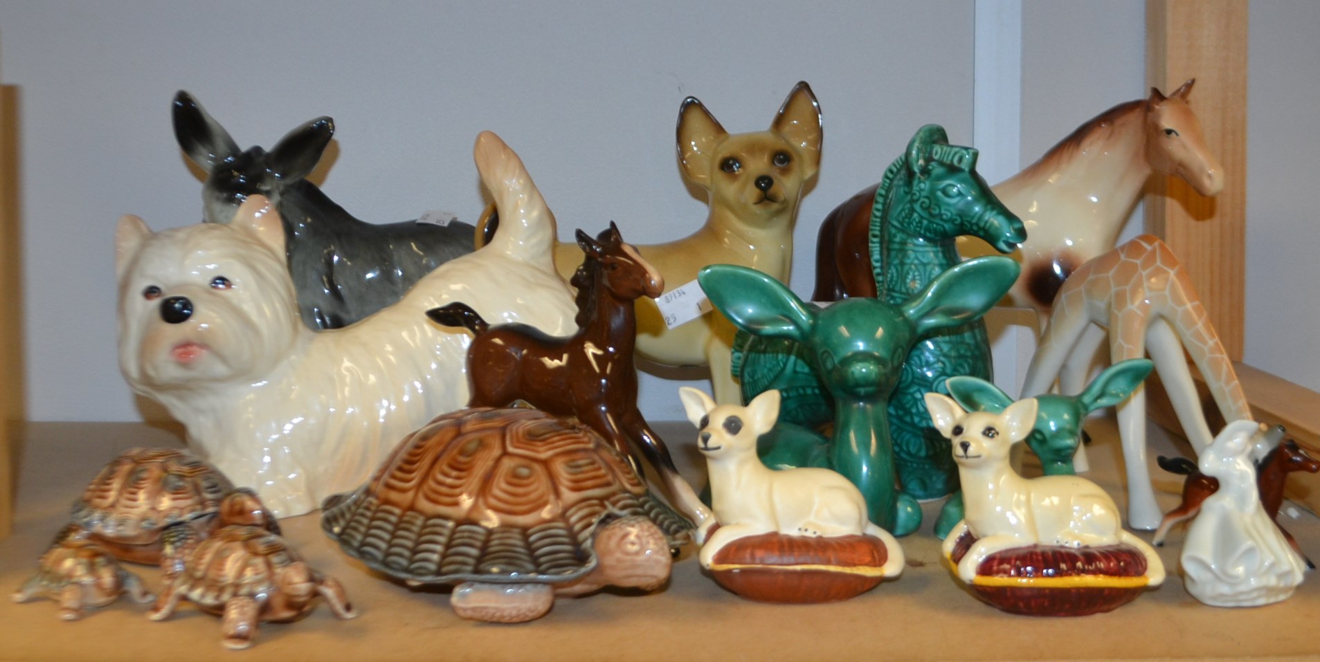 Ceramics - a Beswick foal;  Wade family of tortoises;  a Kingston pottery terrier;
