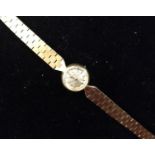 A lady's 9ct gold Cyma wristwatch, baton numerals, articulated solid strap, 15.