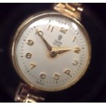 Tudor Rolex - a lady's 9ct gold wrist watch, silvered dial, Arabic numerals, minute track,