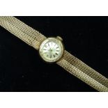 Omega - a 9ct gold lady's wristwatch, round silvered dial, baton markers, manual wind movement,