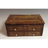 A Napoleonic prisoner of war straw work box, hinged cover decorated with buildings,