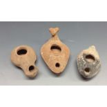 Antiquities - a Roman terracotta oil lamp, moulded with geometric motifs,