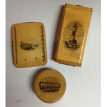 A Mauchline ware cased hourglass, the rectangular front cover printed with Beachy Head Lighthouse,