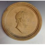 A 19th century earthenware portrait roundel,