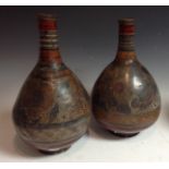 A pair of Central American globular bottle vases, possibly Mexican,