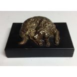 A 19th century gilt bronze desk weight, cast as a sleeping dog, rectangular marble base, 10.