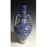 An Iznik-type pottery amphora vase, decorated in underglaze blue with geometric motifs,