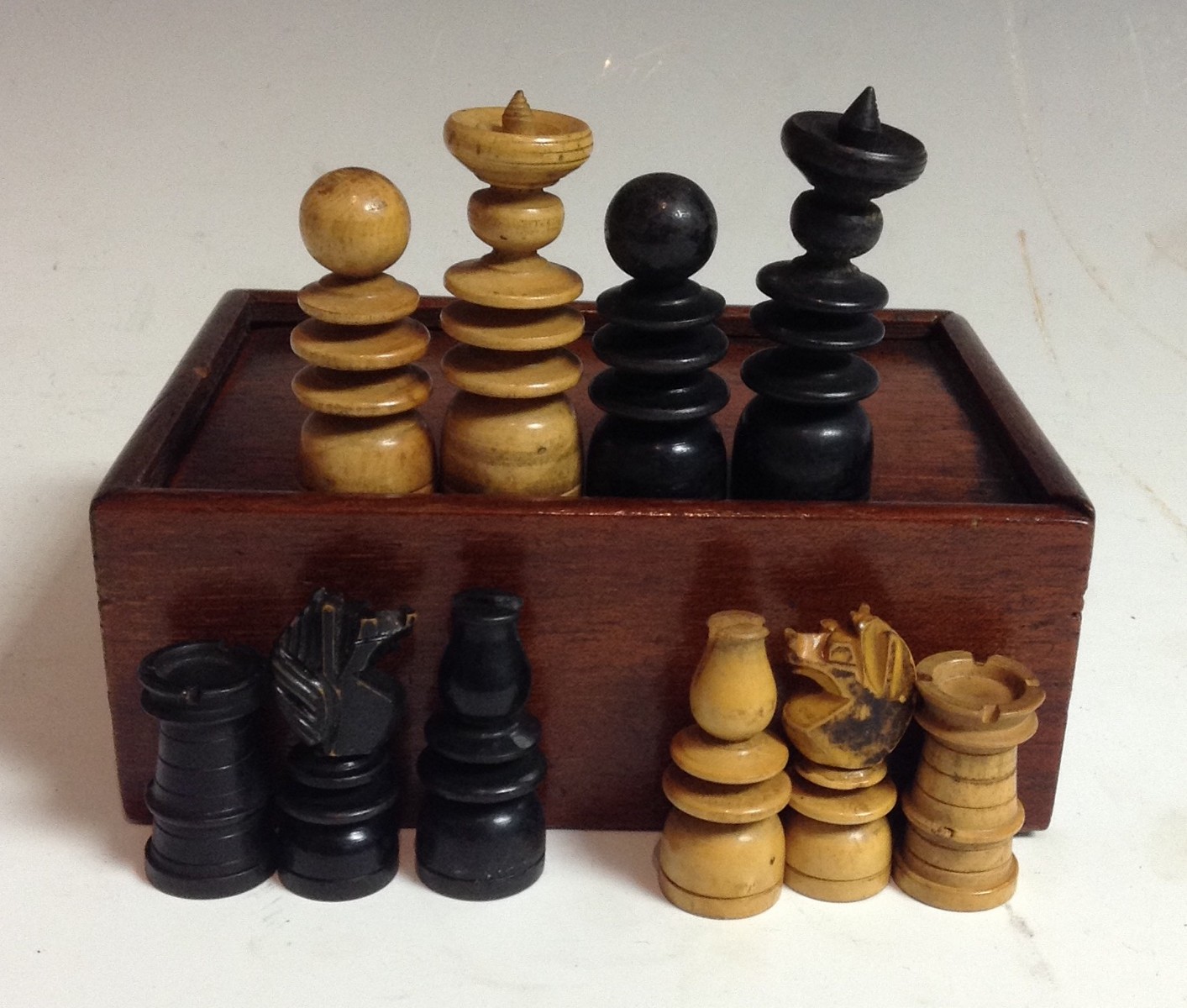 A 19th century English boxwood and ebonised chess set, of ring turned form, the kings 6cm high,