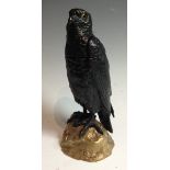 A 19th century gilt and dark patinated bronze novelty inkwell, cast as a bird of prey,