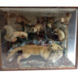 Taxidermy - a Victorian/Edwardian arrangement, with a fox holding a partridge,