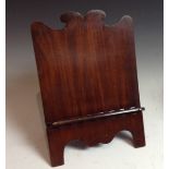 A George IV mahogany folding easel reading stand/table lectern, shaped cresting,