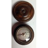 A treen travelling pocket compass, silvered register with rope-twist bezel, draught turned cover, 6.